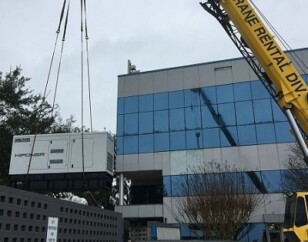Generator being placed via crane