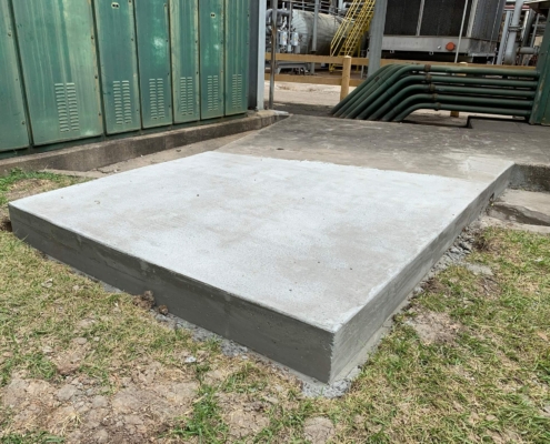 Newly poured concrete pad for standby generator at Gulf Coast Distillers